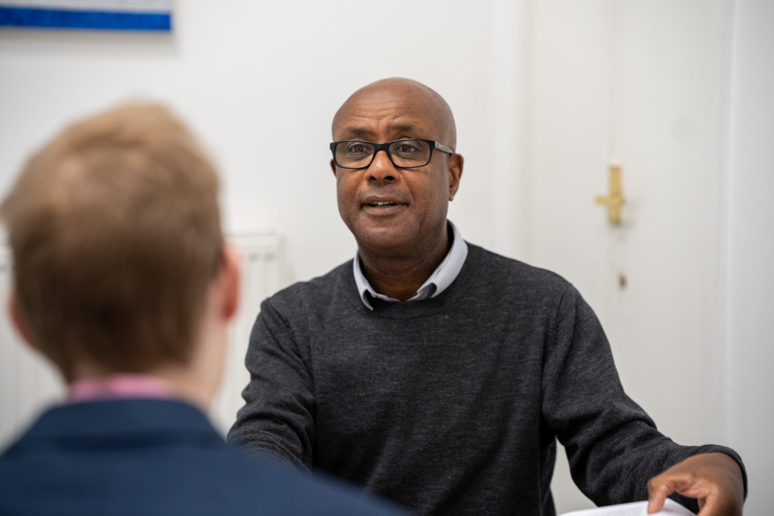 A Careers councillor chats with a student interested in progressing in his Business Career.